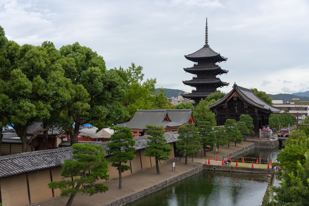 A scenic view of a pagoda and a pond