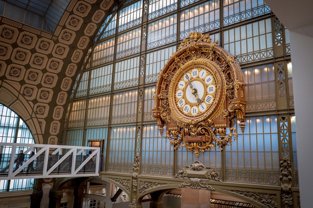 A large clock mounted to the side of a building