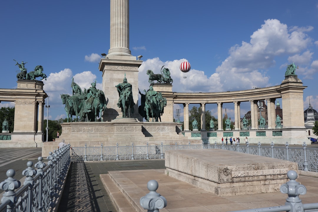 A monument with a clock on top of it