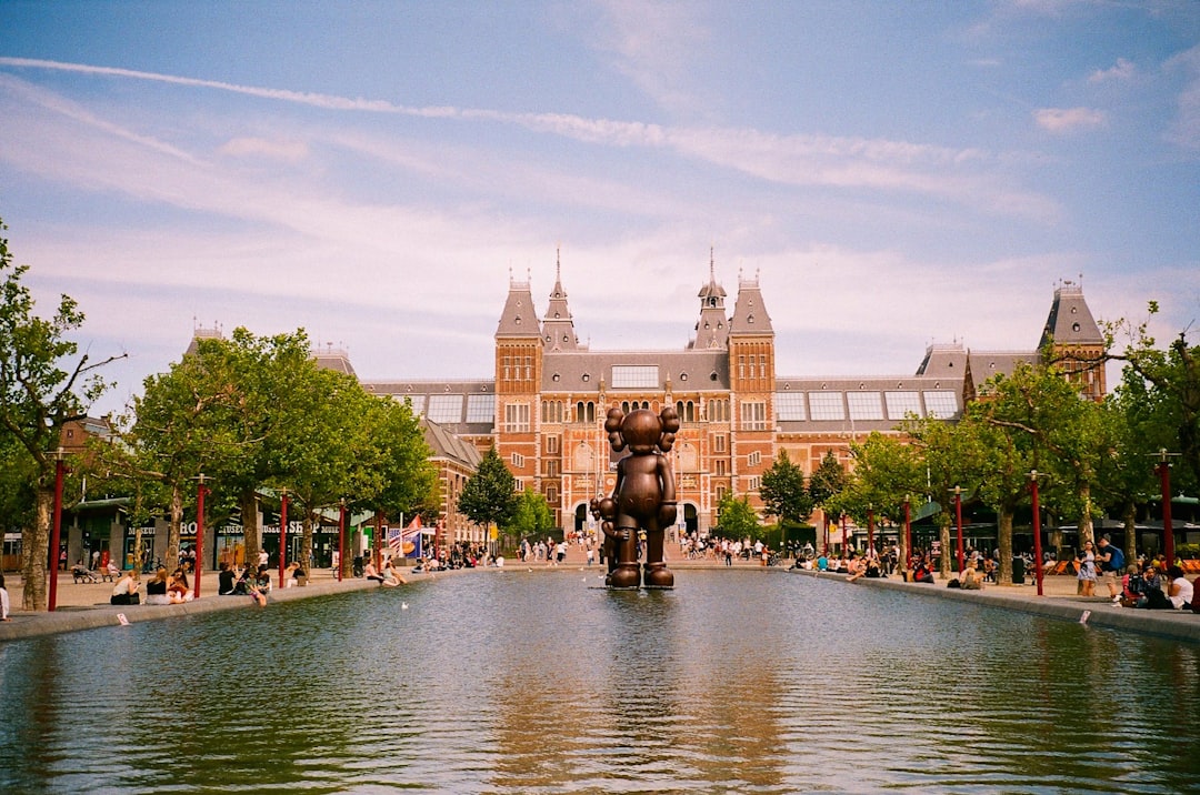 a large building with a fountain in front of it