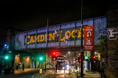 A train crossing over a street at night