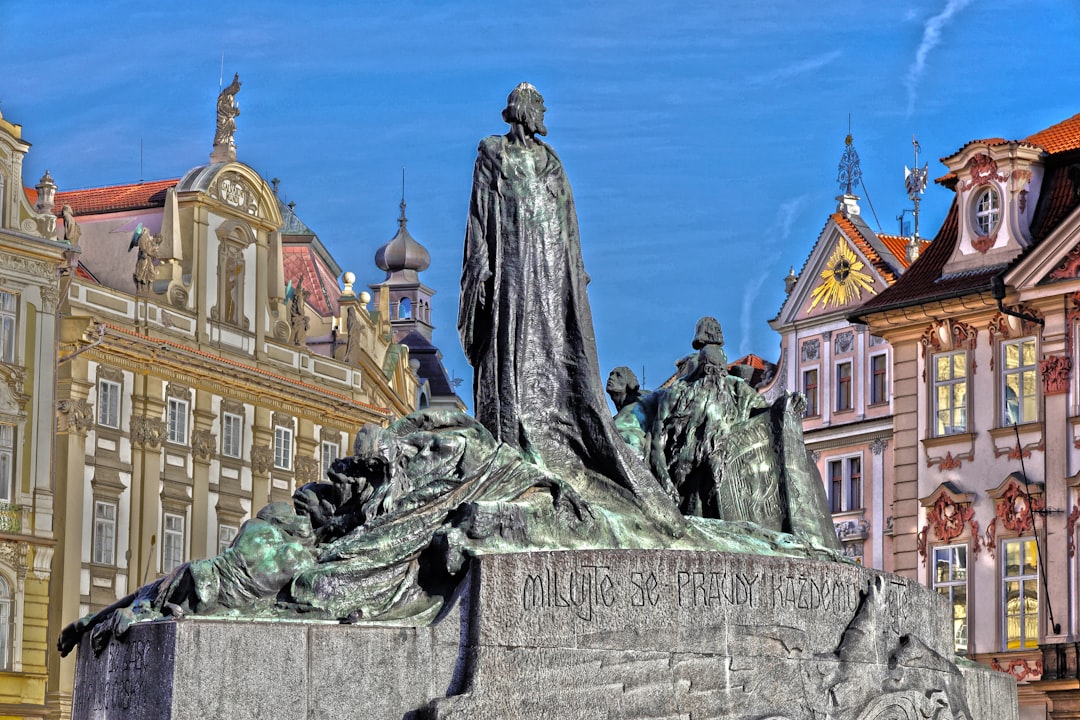 a statue in front of a building in a city