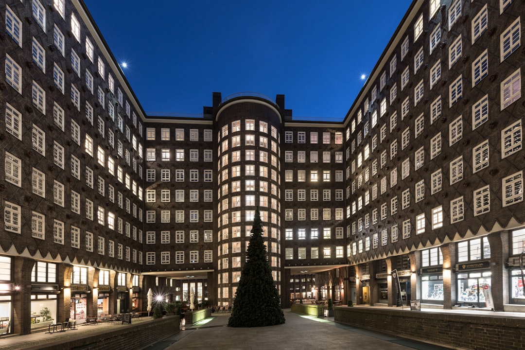 A large building with a lot of windows at night