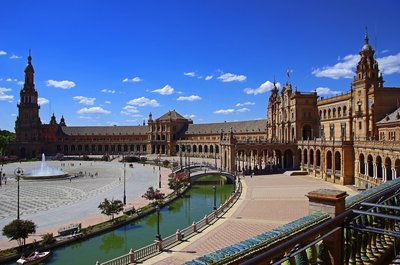 a large building with a fountain in front of it
