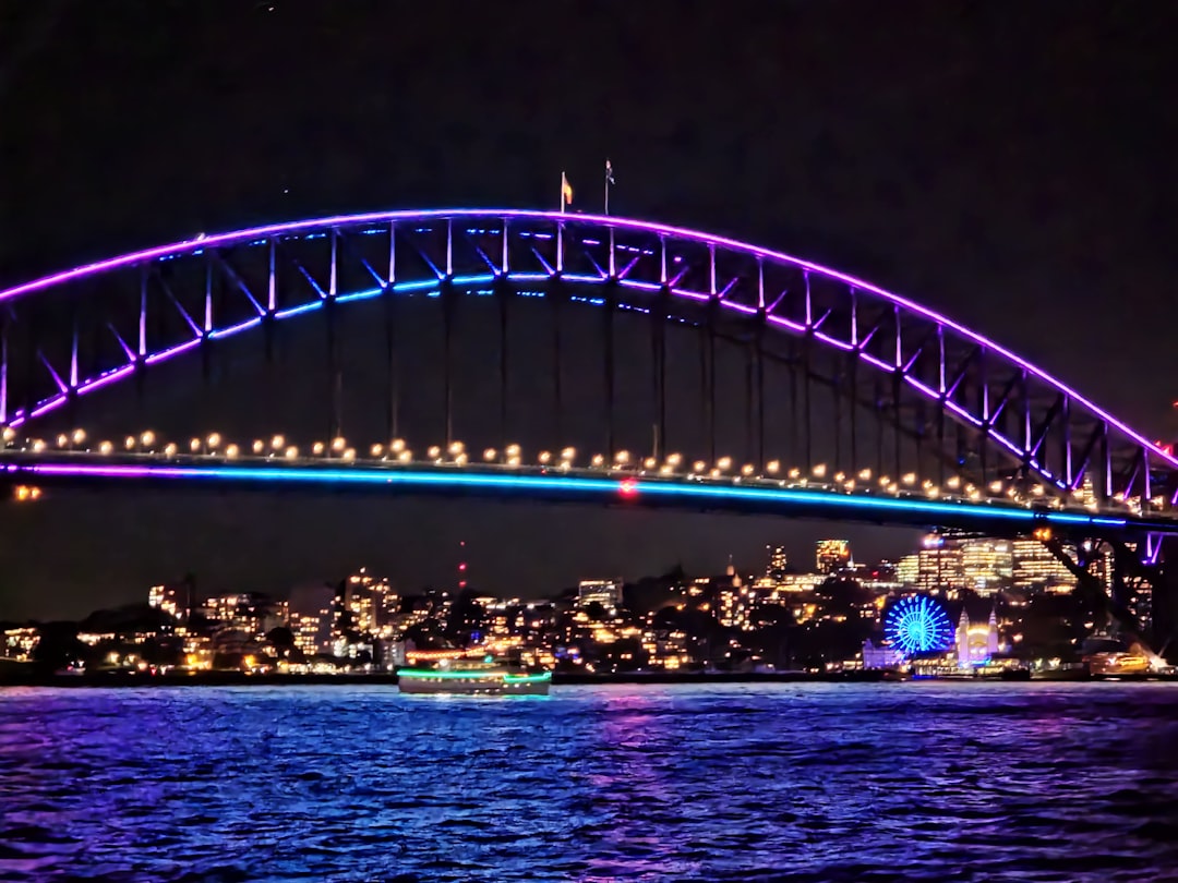 a large bridge over a body of water at night