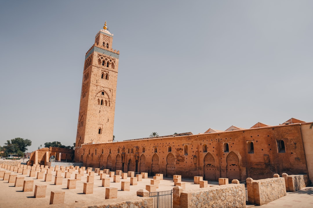 Tall minaret and courtyard of a historic mosque.