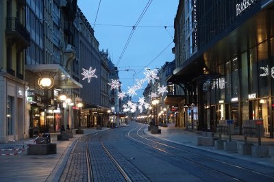 Rue du Rhône, elegant shopping street lined with luxury boutiques and stylish cafés.