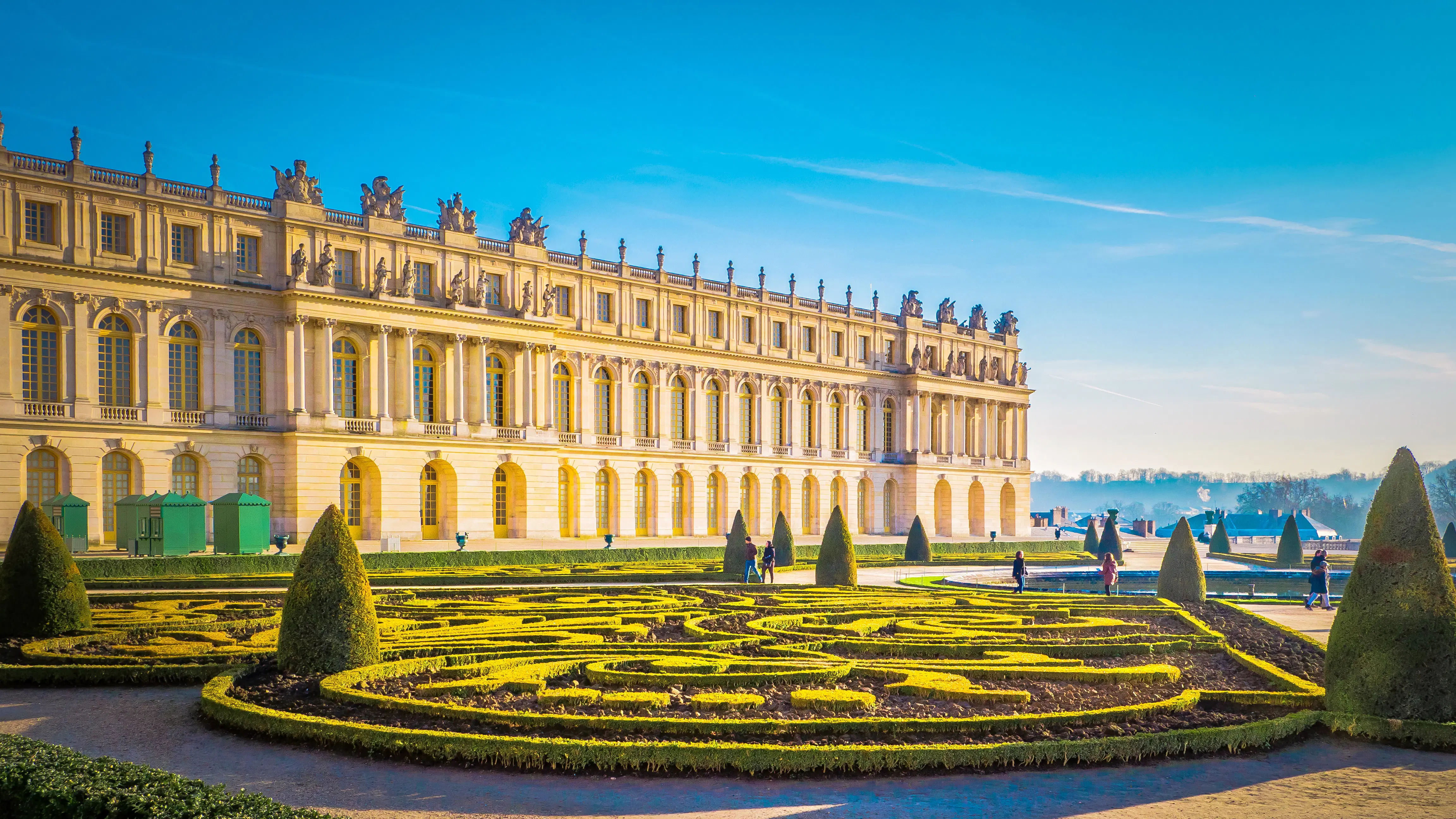 The majestic Palace of Versailles with grand architecture and elegant gardens.