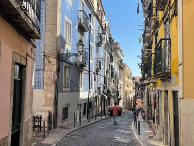 Colorful Bairro Alto filled with street art, cafés, and a bohemian atmosphere.