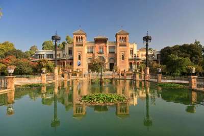 Parque de María Luisa, a lush Seville park with shaded paths, fountains, and vibrant gardens.