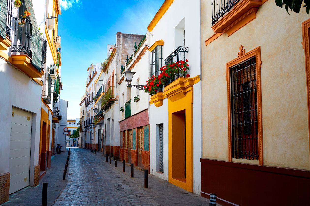 Barrio de Triana, a vibrant Seville neighborhood known for flamenco and ceramic workshops.