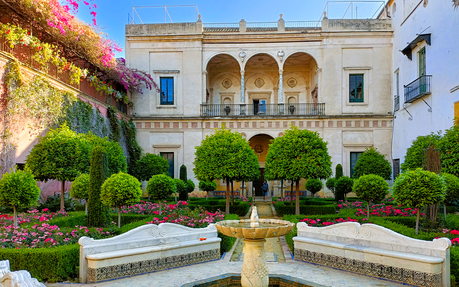 Casa de Pilatos, a historic Seville palace with ornate courtyards and elegant arches.